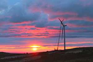 Just before midnight, a blade is attached to a wind turbine at the Eva Creek Wind Farm in Ferry, Alaska