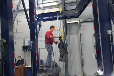 A Capital Safety technician tests a harness with weighted dummy body. The company maintains its own testing lab, rather than using an outside facility, in part so that tests are done in a timely manner.