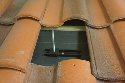 Figure 3. Track style mounts are difficult to flash at the deck level, so they are often left unflashed resulting in a code violation