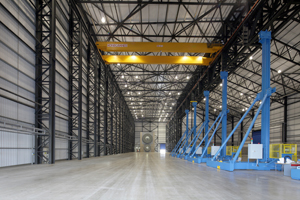 A 15-meter concrete superstructure test hub stands at the far end of Narec's blade-testing facility. Towers (right) will carry hydraulic piping to a Control Resonance Mass (CRM), which is used to evaluate blades.