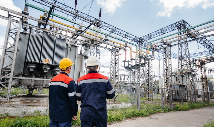 2 people looking at transformer