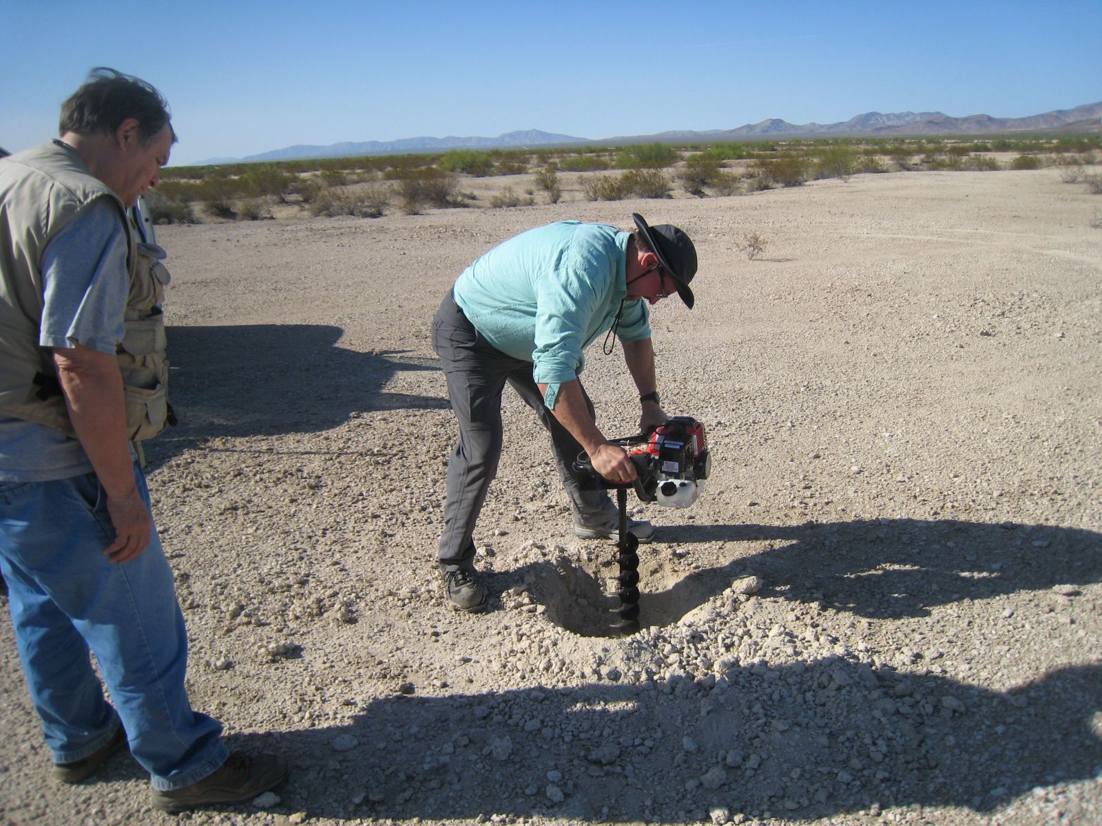 two people drilling