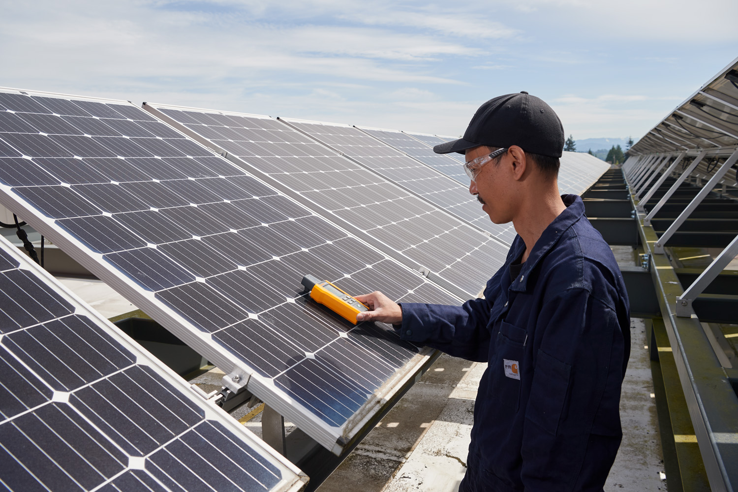 guy measuring solar panel