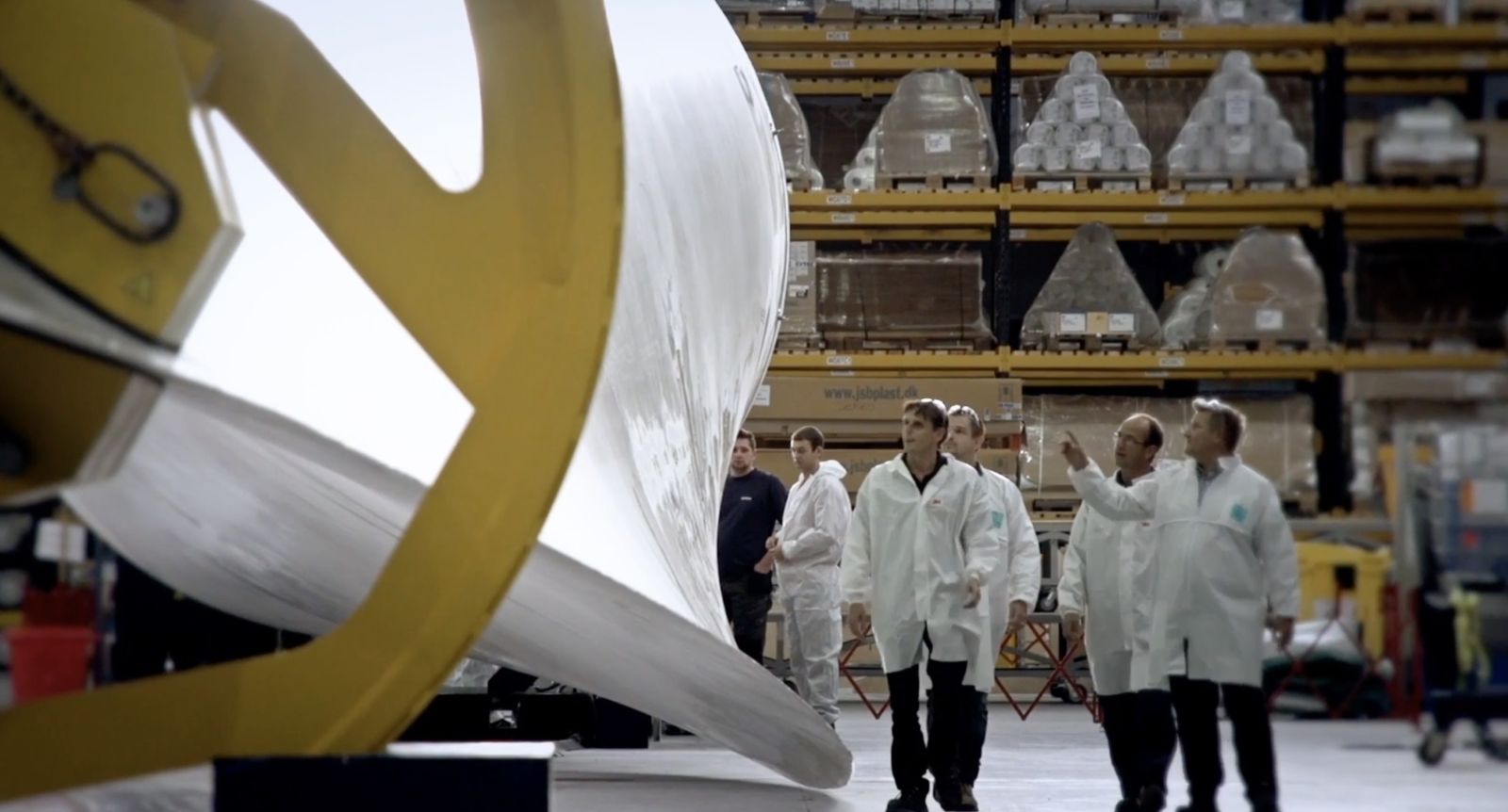 white coat men staring at blurry wind thing