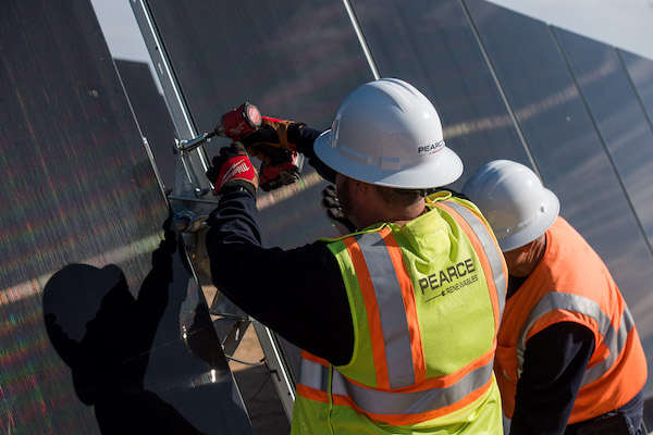 man working on panel 