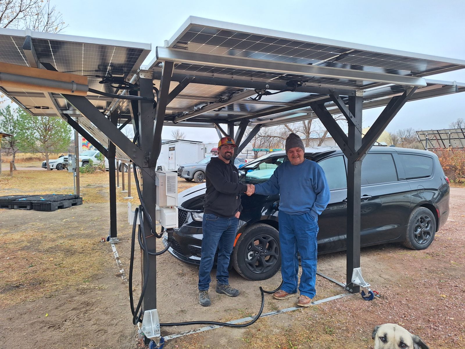 2 people under solar canopy