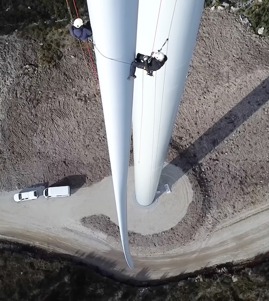 dangling from wind tower
