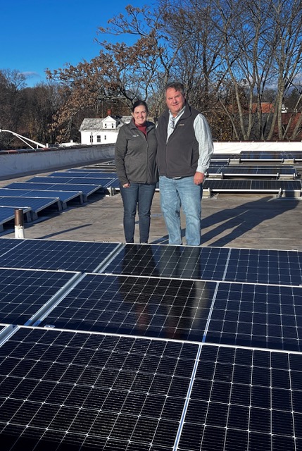 Verogy and Wayne Valaitis, Chief Executive Officer - Women & Families Center of Meriden (WFC) celebrate the completion of WFC’s rooftop solar installation.