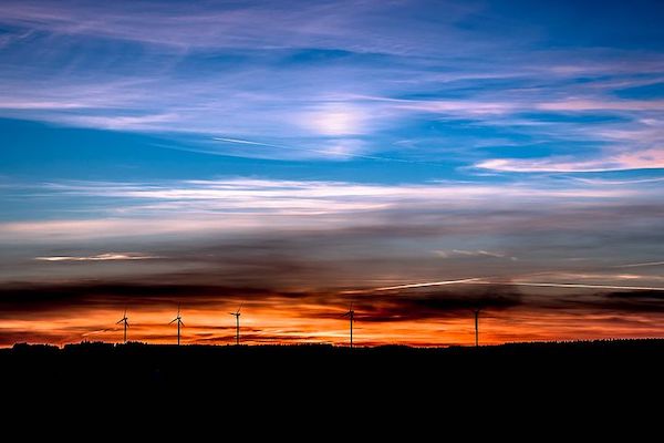sunset far away turbines