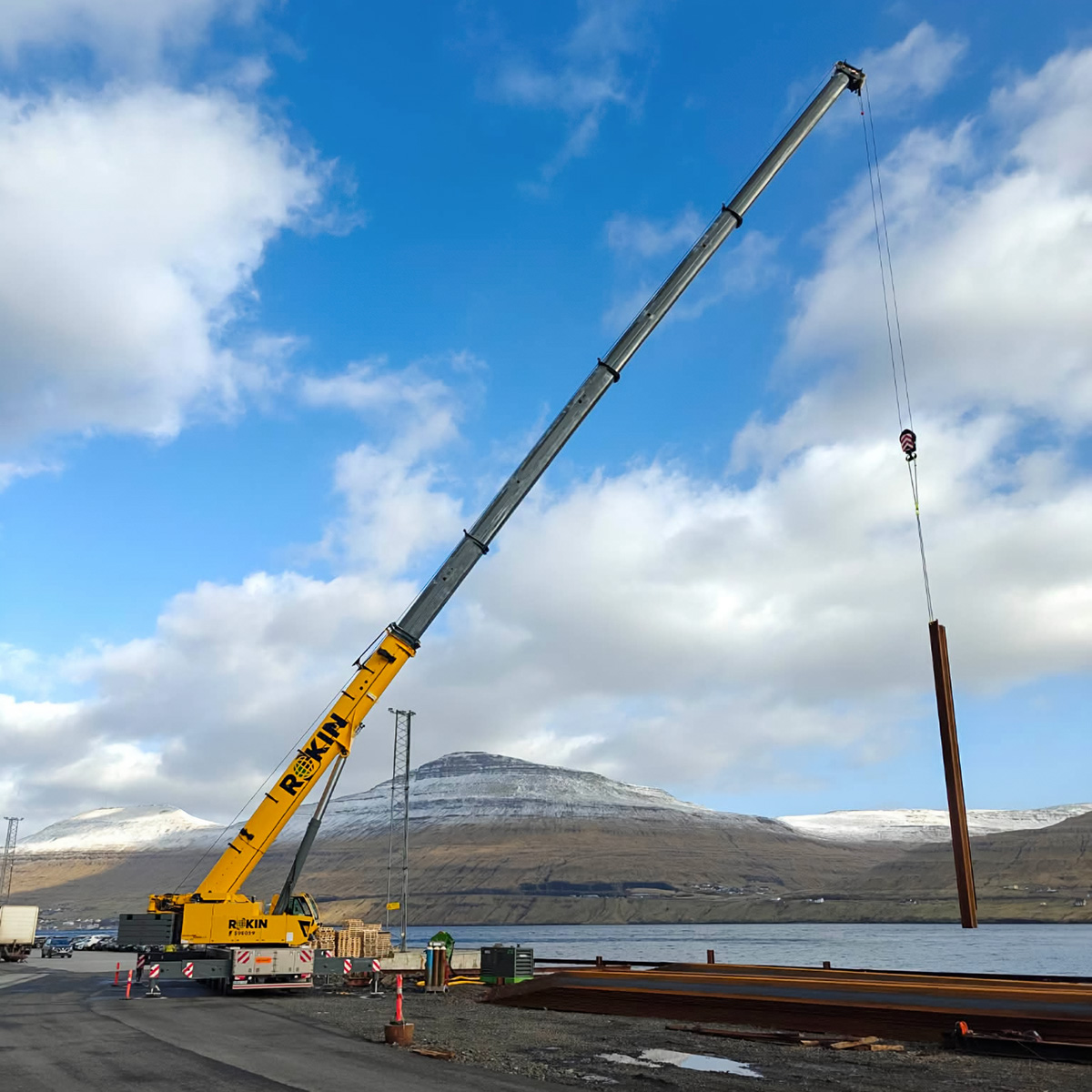 yellow crane blue sky