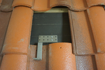 Figure 2. Unflashed tile hooks are a common code violation