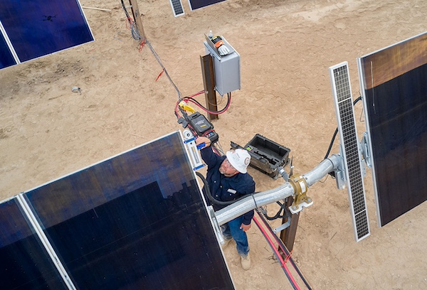guy between solar panels