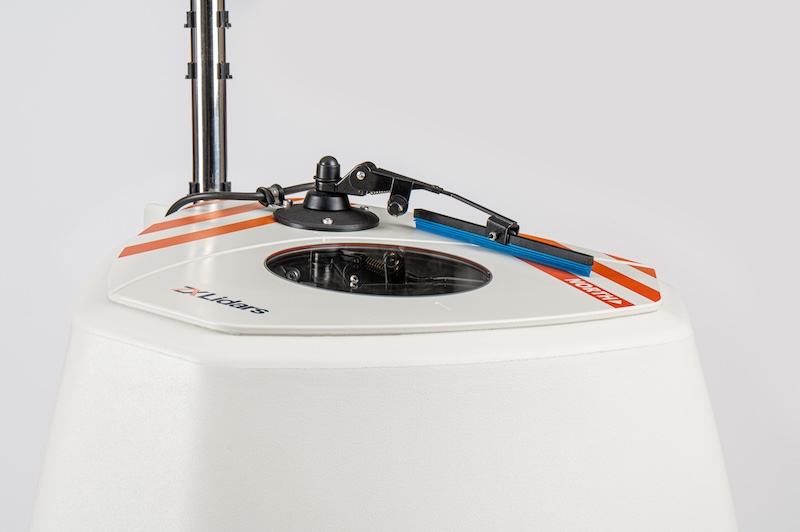 white thing with metal pole sticking out of the top