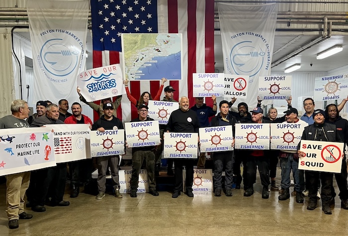 people holding signs
