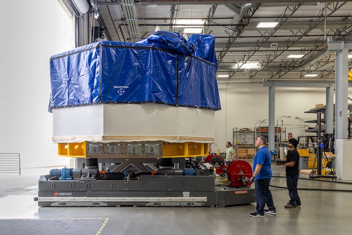 blue tarp covered large component