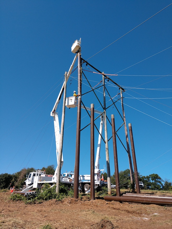 utility poles blue sky