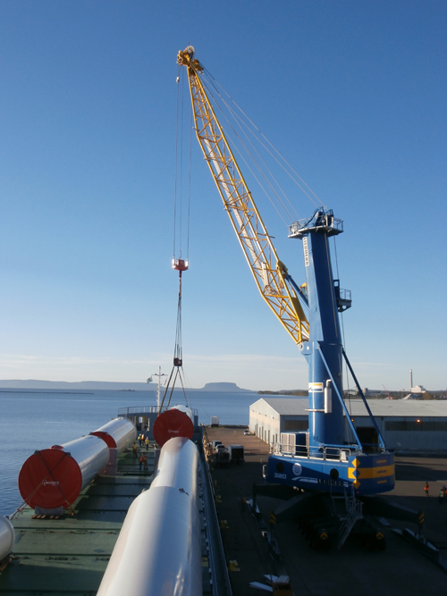 From blades to towers, wind energy components being discharged at a port in Canada